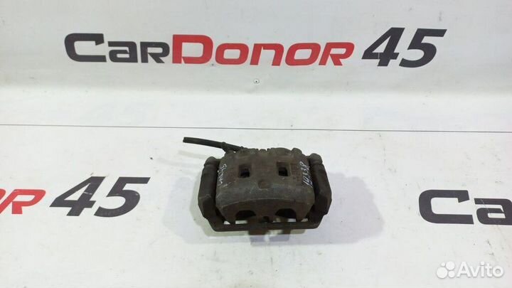 Суппорт передний левый б/у для Subaru Legacy (2629