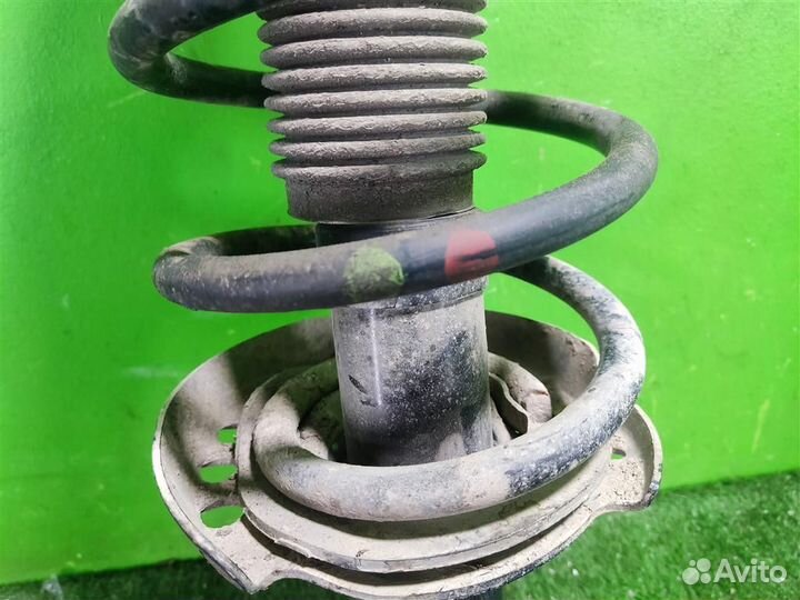 Стойка амортизатора передняя правая KIA Sportage