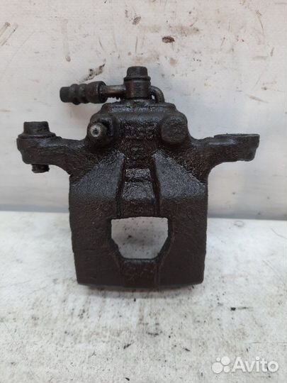 Суппорт тормозной задний левый Nissan Qashqai