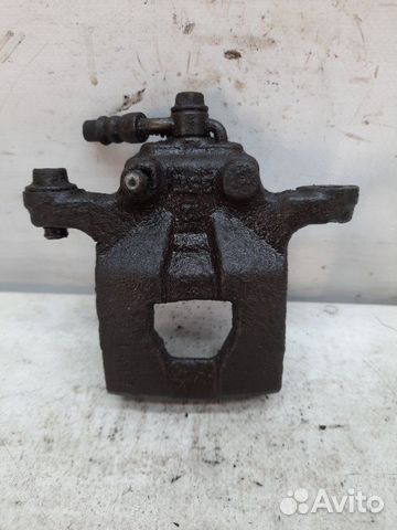 Суппорт тормозной задний левый Nissan Qashqai