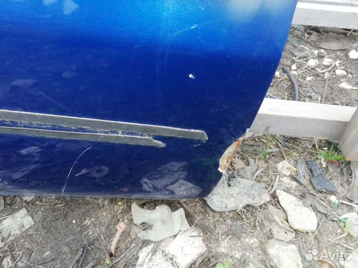 Дверь Мазда Демио 1