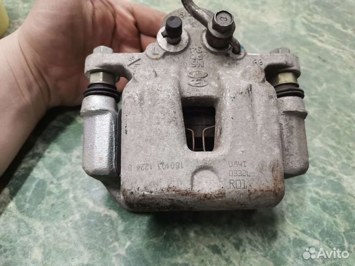 Суппорт задний левый Kia K3