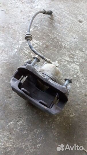 Суппорт тормозной передний левый Chevrolet Aveo