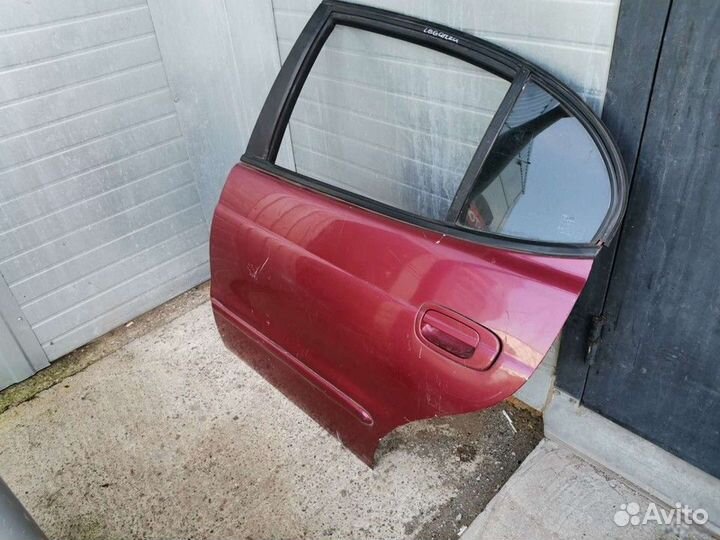 Дверь задняя левая со стеклом (Daewoo Leganza)