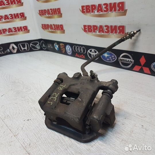 Суппорт тормозной задний левый Nissan Teana J32