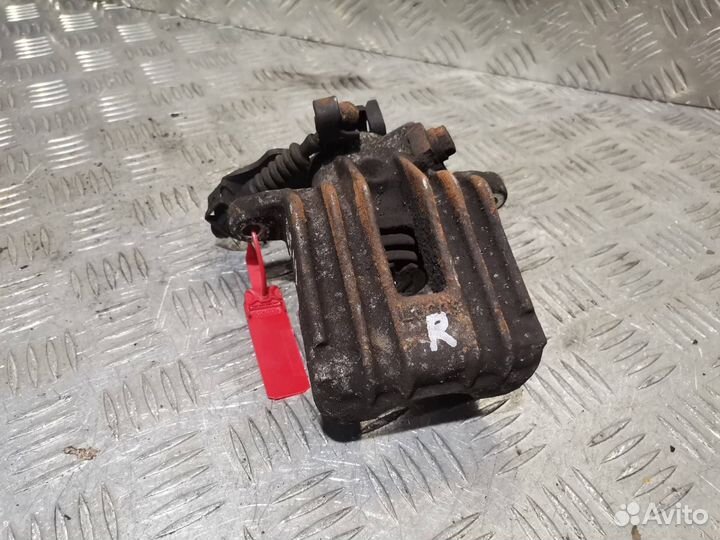 Суппорт тормозной задний правый Skoda Roomster