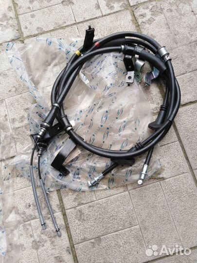 Трос стояночного тормоза kia sportage 2