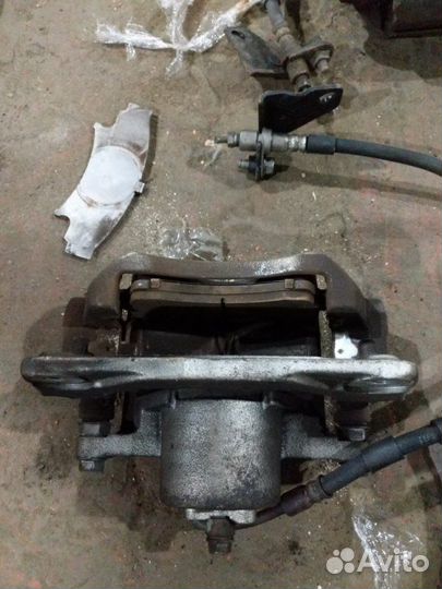 Суппорт тормозной передний левый Mazda 6 GH