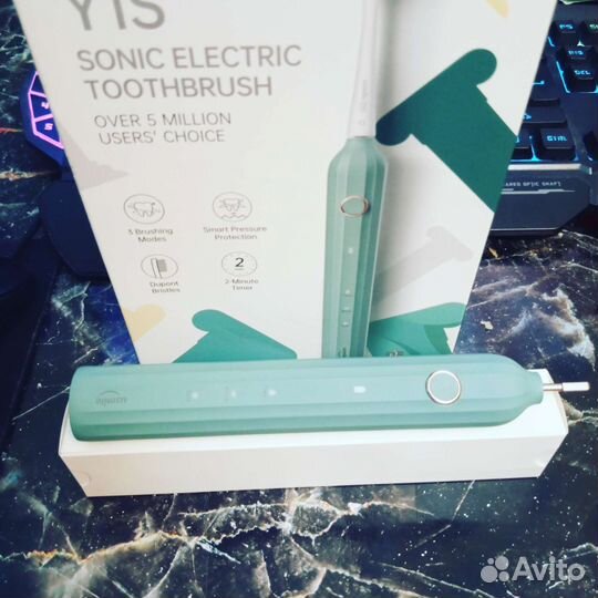 Электрическая зубная щетка