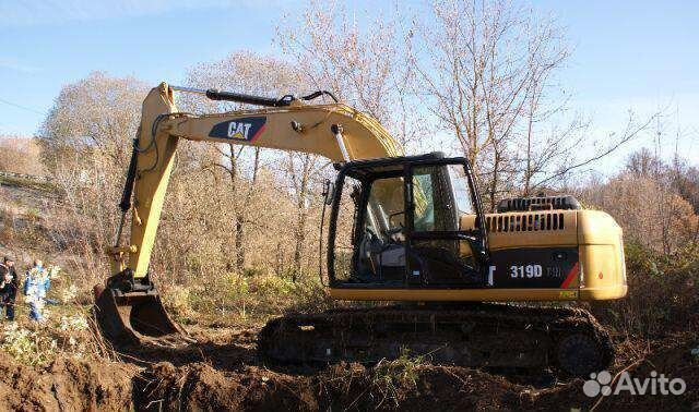 Машинист экскаватора вологда. Caterpillar 319. Cat 319 экскаватор. Катерпиллер 319 экскаватор разбор ленивца. Cat 319 экскаватор аналоги.