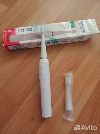 Электрическая зубная щетка новая