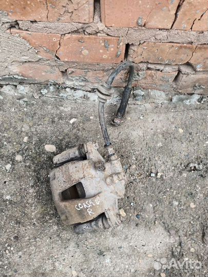 Суппорт тормозной передний Opel Corsa D