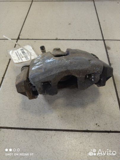 Суппорт тормозной передний правый Skoda Rapid 1