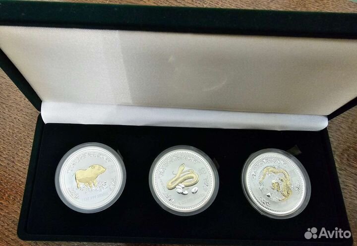 Серебряные монеты Восточный календарь с позолотой