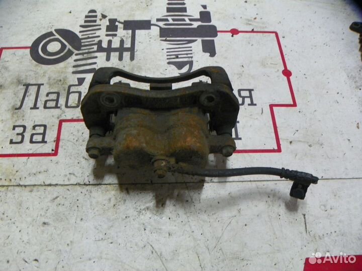 Суппорт тормозной передний левый Kia Sorento