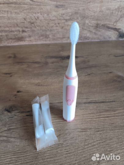 Электрическая зубная щетка
