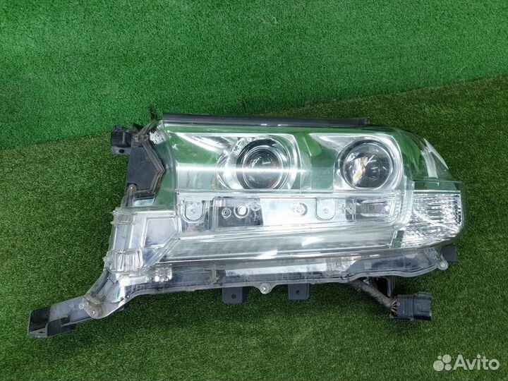 Фара левая Toyota Land Cruiser