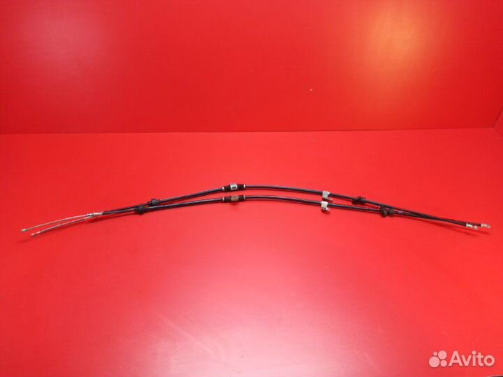 Трос стояночного тормоза задний Mitsubishi Lancer