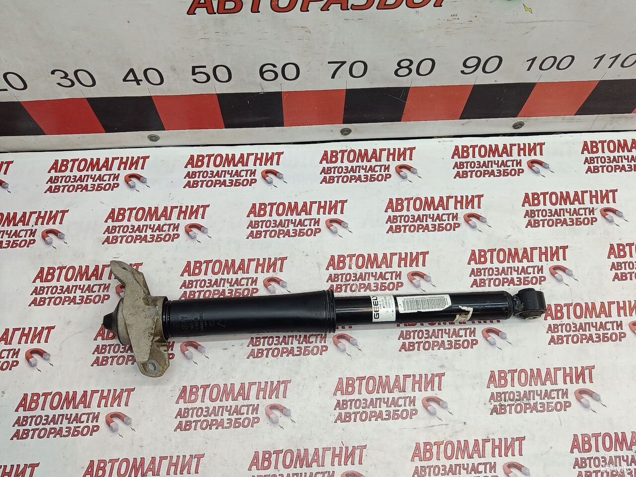 Амортизатор задний левый Джили Тугелла