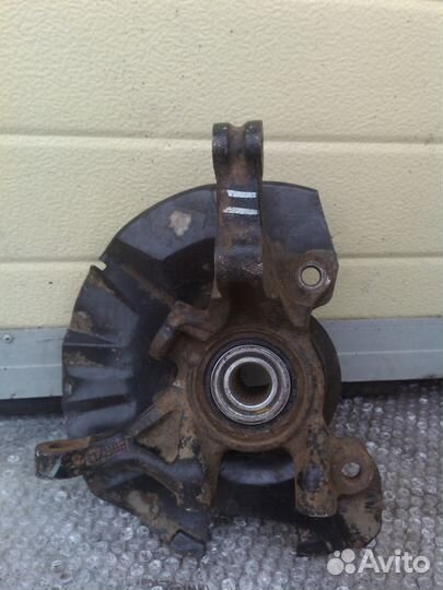 Киа Рио 2 левый поворотный кулак