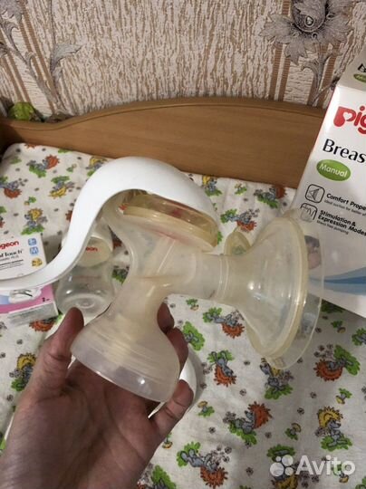 Молокоотсос ручной (+ 4 пакета для молока)