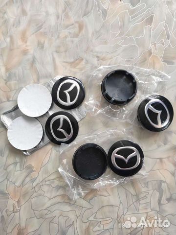 Колпачки и эмблемы Mazda