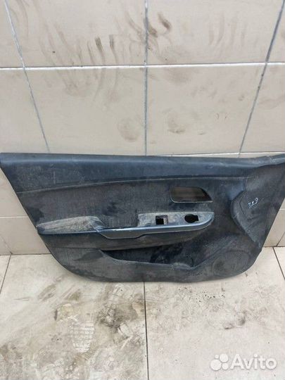 Обшивка двери передняя левая Kia Rio