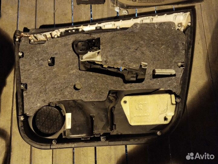 Обшивка двери передней левой Toyota Corolla E15