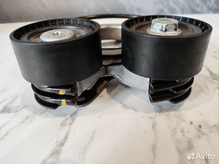 Натяжитель ремня 06N903133