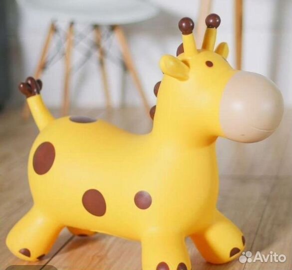 Игрушка прыгалка музыкальная Корова Жираф