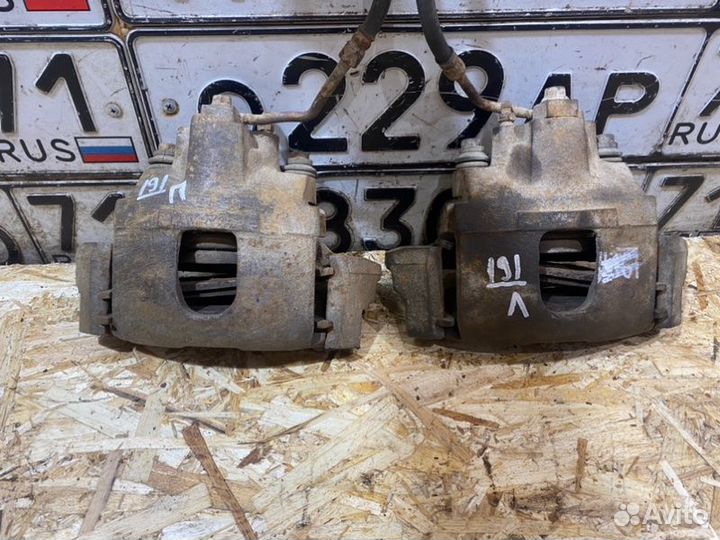 Тормозной суппорт передний Kia Sportage 2000