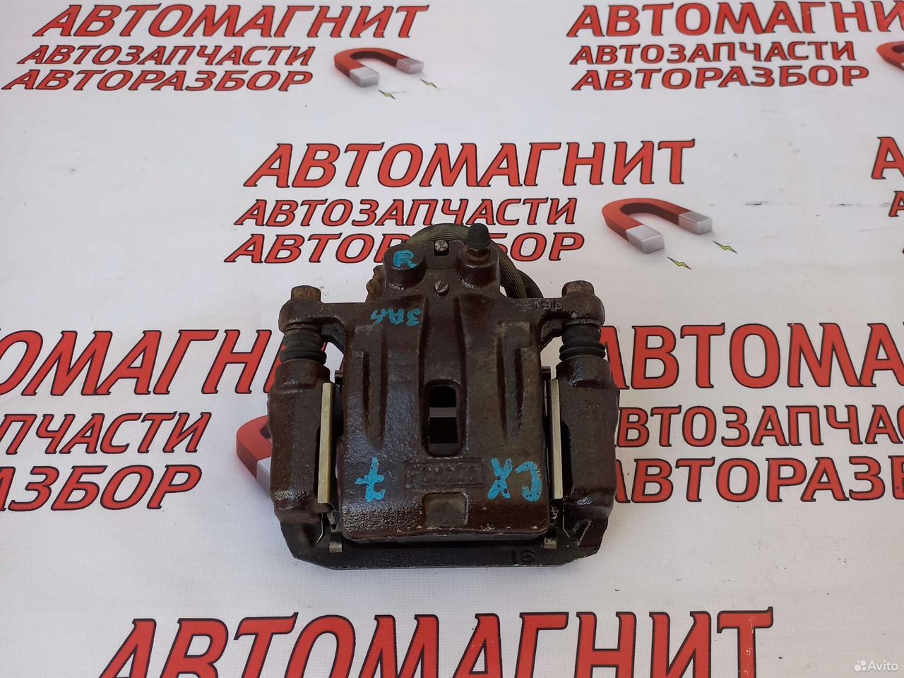 Супорт задний правый Мазда CX-7