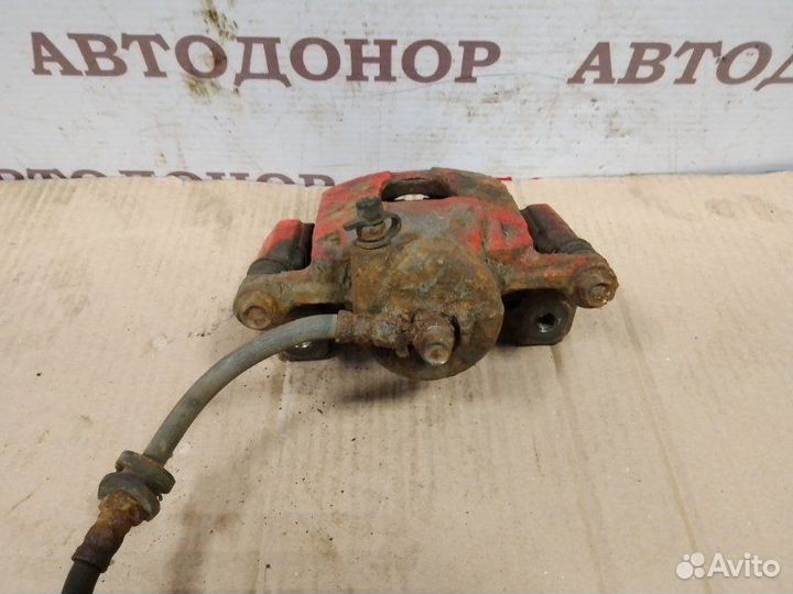 Суппорт тормозной передний левый Chevrolet Aveo