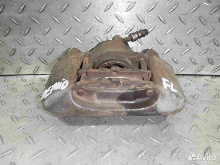 Суппорт тормозной передний левый Mazda Demio