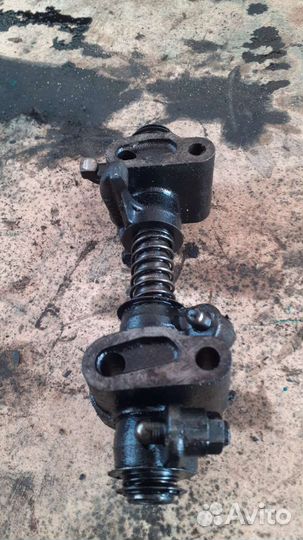 Ось коромысел в сборе ман