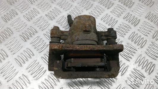 Суппорт тормозной задний левый toyota corolla E12