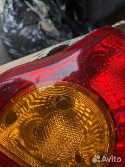 Фонарь задний левый Toyota Corolla E150 оригинал