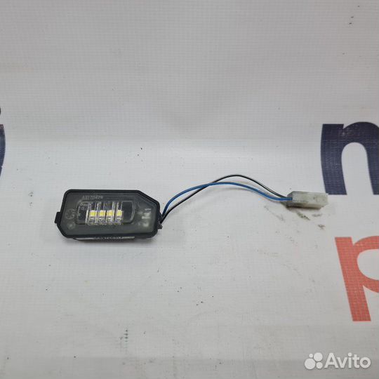 Фонарь подсветки номера левый Mercedes-Benz