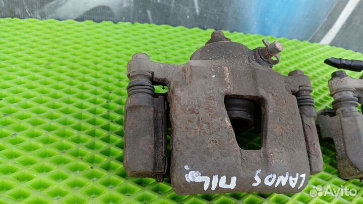 Суппорт тормозной передний левый lanos