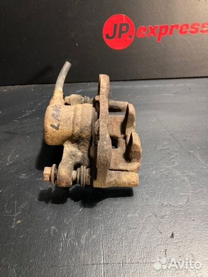 Суппорт тормозной задний левый Mitsubishi Lancer 9