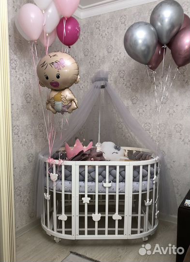 Детская кроватка с маятником