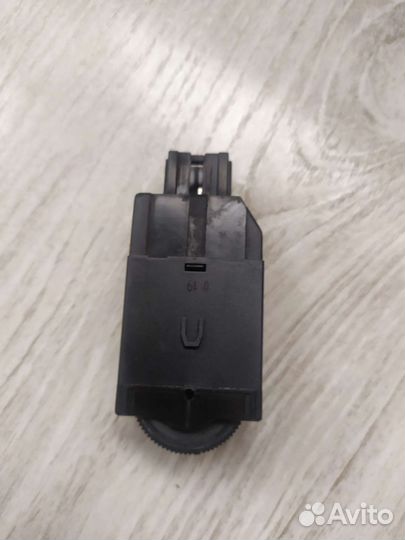 Кнопка регулировки угла наклона фар Mitsubishi