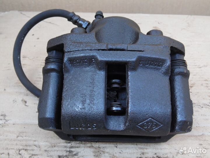 Суппорт передний левый Ниссан Альмера Н16