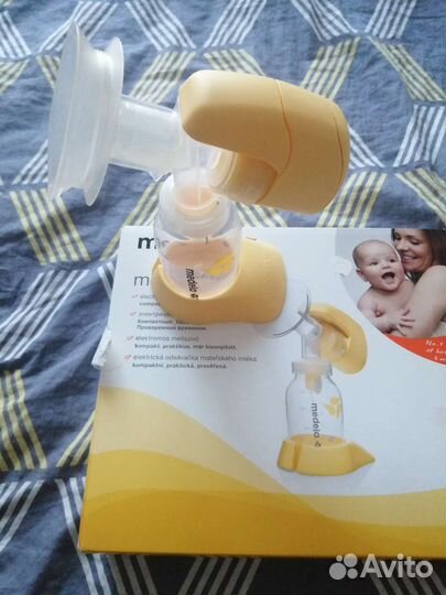 Молокоотсос medela электрический