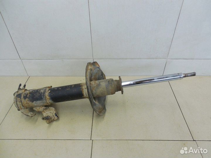 Амортизатор передний левый Almera Tino 2000-2006