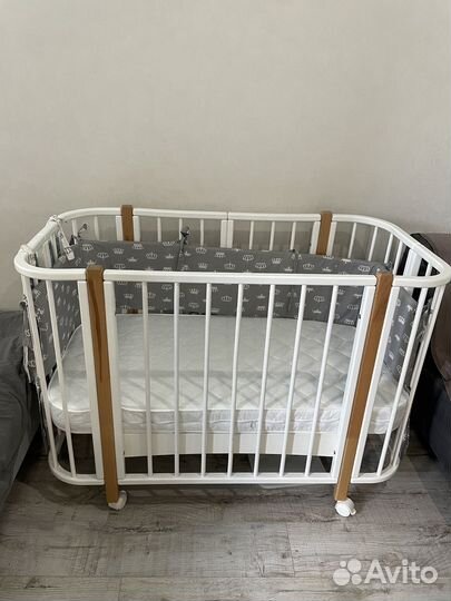 Детская кроватка с продольным маятником