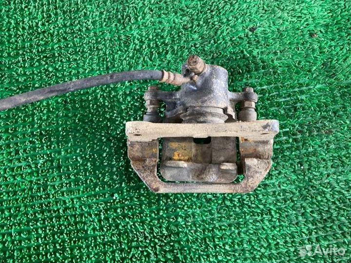 Суппорт тормозной лев. зад. Toyota Land cruiser, L