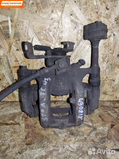 Суппорт тормозной задний левый Opel Astra J