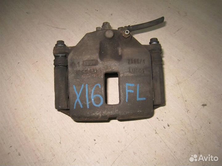 Суппорт тормозной передний левый Nissan Almera Ti