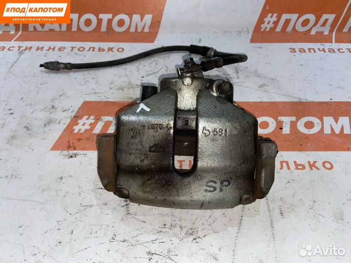 Суппорт тормозной передний левый Volkswagen Passat